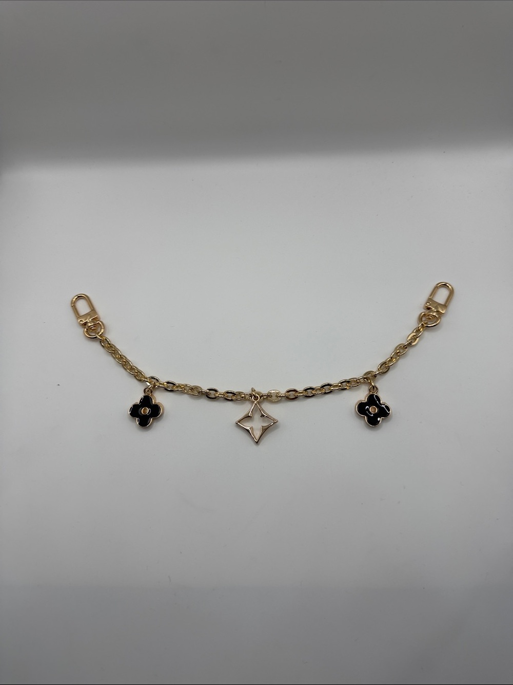 160. Gold-Tone Charm Bag Chain with Black and White Flower Charms 11”